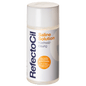 RefectoCil Saline Solution 11 ml bottle for eyelash and eyebrow tinting, used to cleanse and optimize tint results, clear liquid. Round plastic container with orange and blue lettering