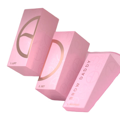 "Brow Lift Kit, perfect for achieving fuller, defined brows, available at A & E Beauty Supplies. Pink round box with gold lettering"