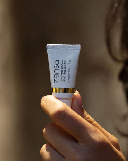 Zensa numbing cream, topical anaesthetic for tattoos, permanent makeup needle needling, laser hair removal treatment, waxing, sugaring, Numbing cream for electrolysis google fast and effective numbing cream. Natural numbing cream, vegan, cruelty free, anti-inflammatory ingredients like Vitamin E
This ad is for one 30 ml tube in a box Gold with white Zensa bottle lidocaine cream